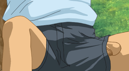 Alan lying back on the grass with the head of his dick peeking out of his outerwear shorts along his left leg